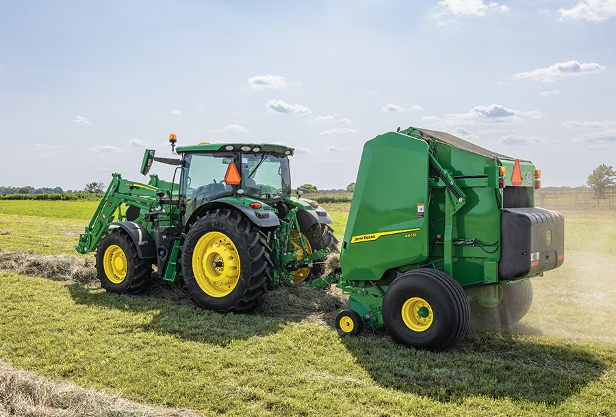 Tractors pulling silage balers benefit from flow control valves