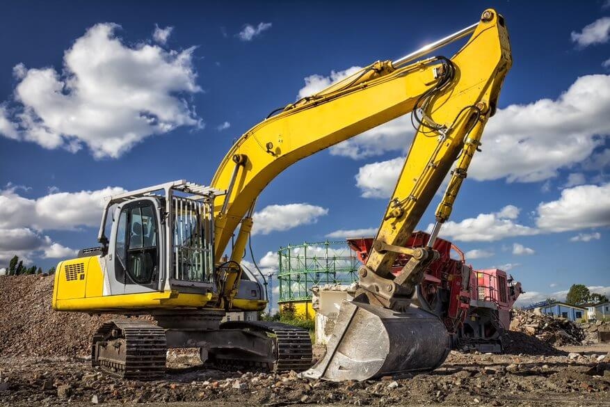 Hydraulic valve architectures for heavy construction machinery